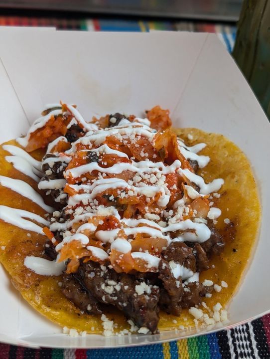 Loaded BLZN nachos topped with crema